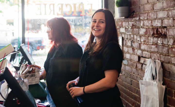 Young female business owner looking to camera